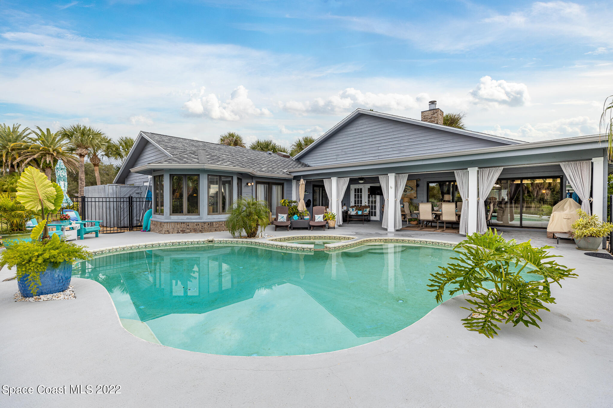 810 Kerry Downs Circle Melbourne, FL 32940 - Photo 5 of 59 a view of a house with swimming pool and a porch