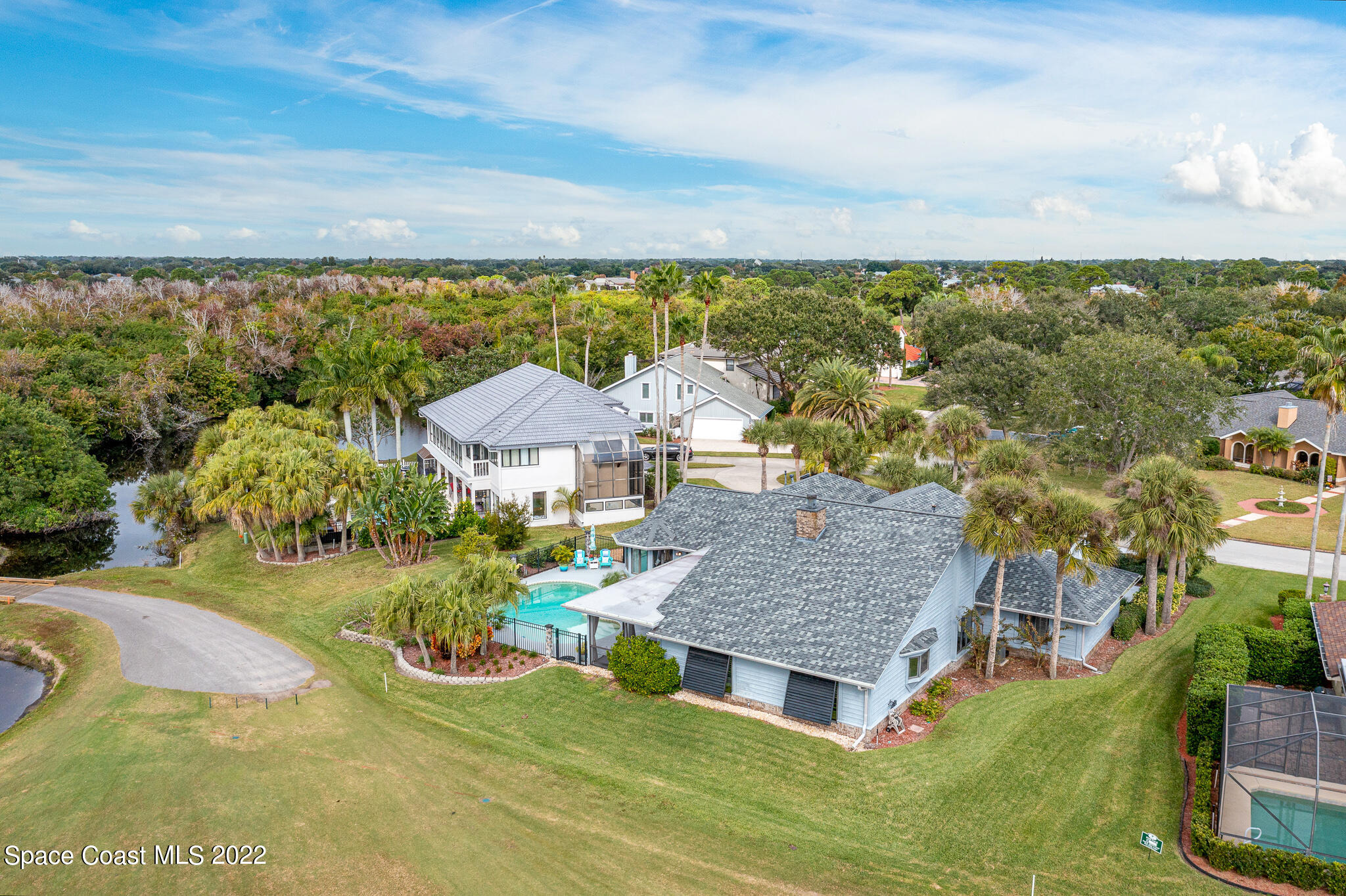 810 Kerry Downs Circle Melbourne, FL 32940 - Photo 51 of 59 an aerial view of residential houses with outdoor space and trees