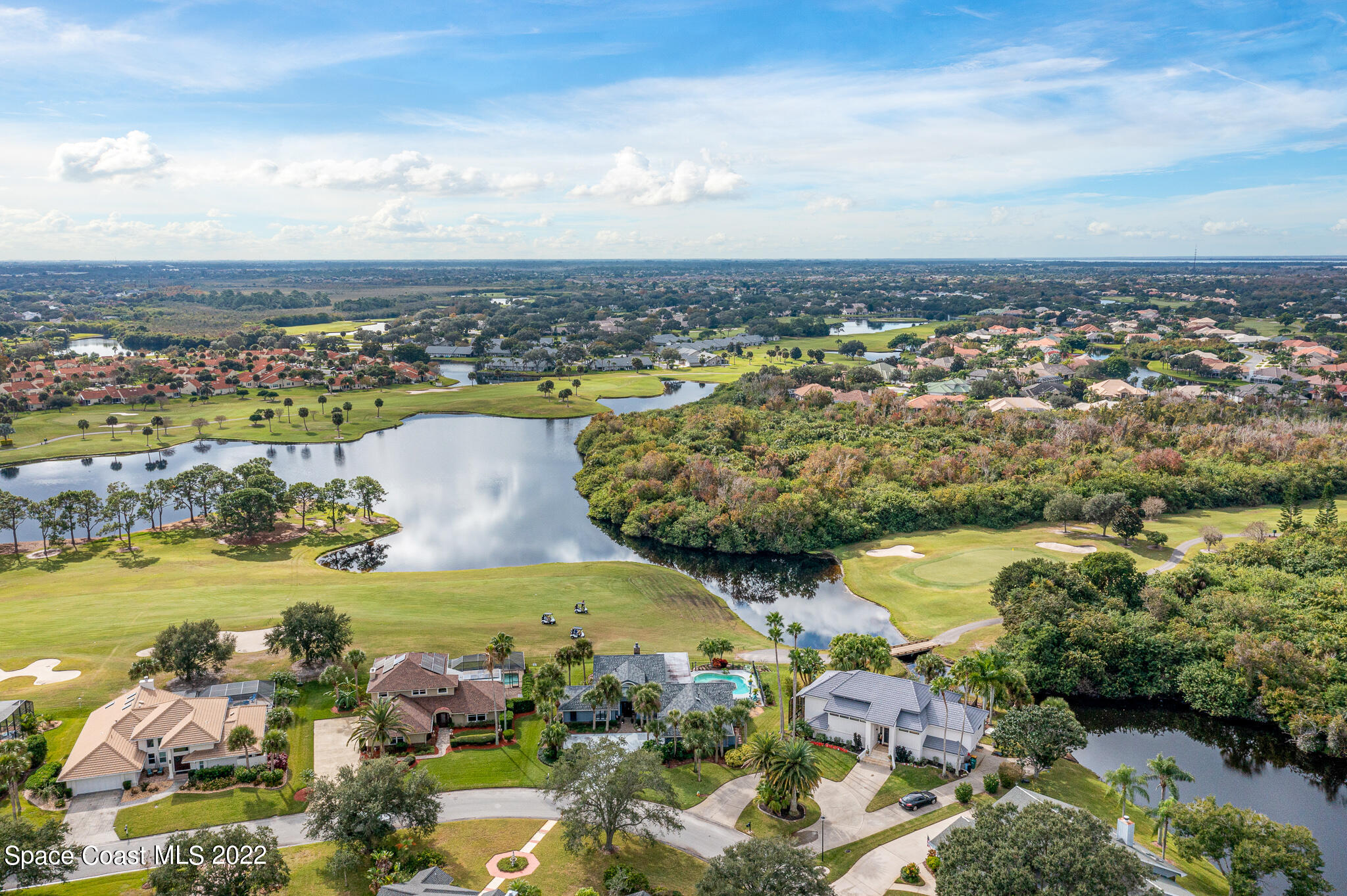 810 Kerry Downs Circle Melbourne, FL 32940 - Photo 52 of 59 an aerial view of ocean and residential houses with outdoor space