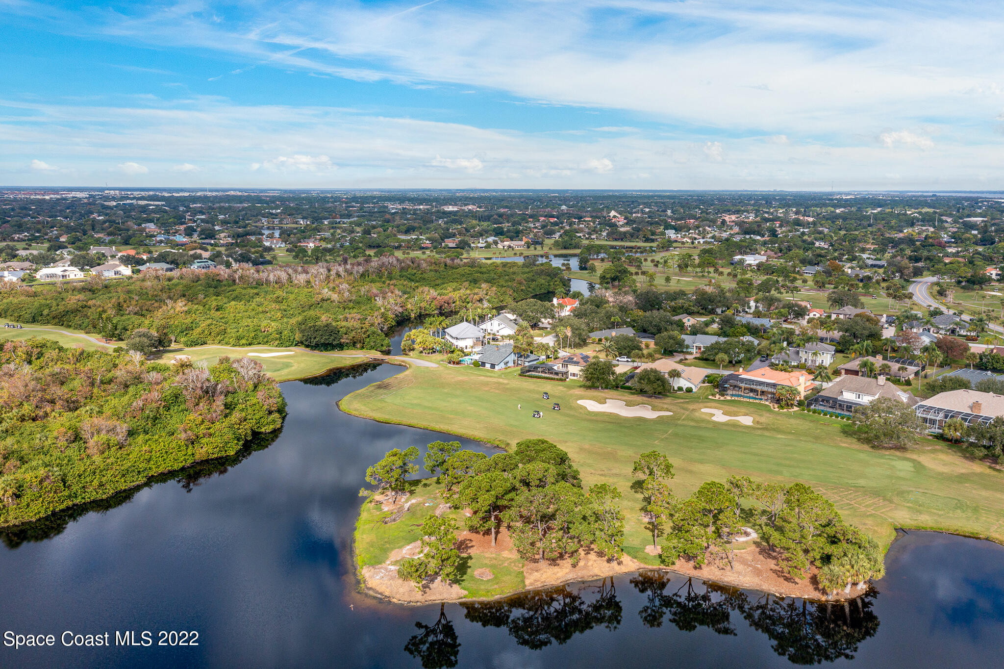810 Kerry Downs Circle Melbourne, FL 32940 - Photo 54 of 59 a view of a lake with a city