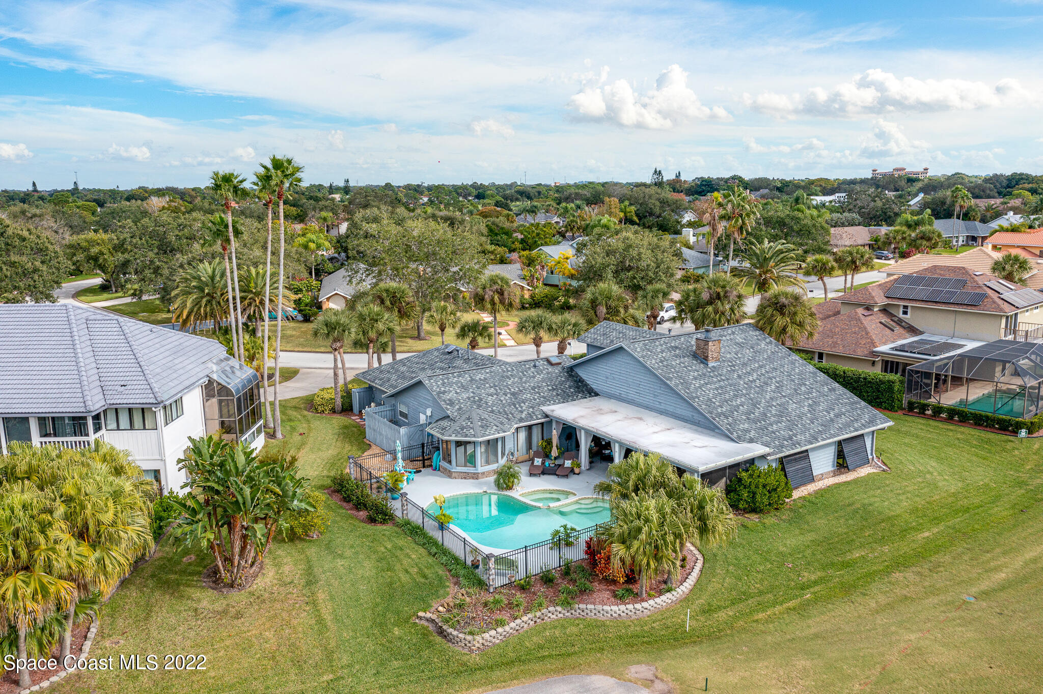 810 Kerry Downs Circle Melbourne, FL 32940 - Photo 6 of 59 a view of a house with a big yard plants and large trees