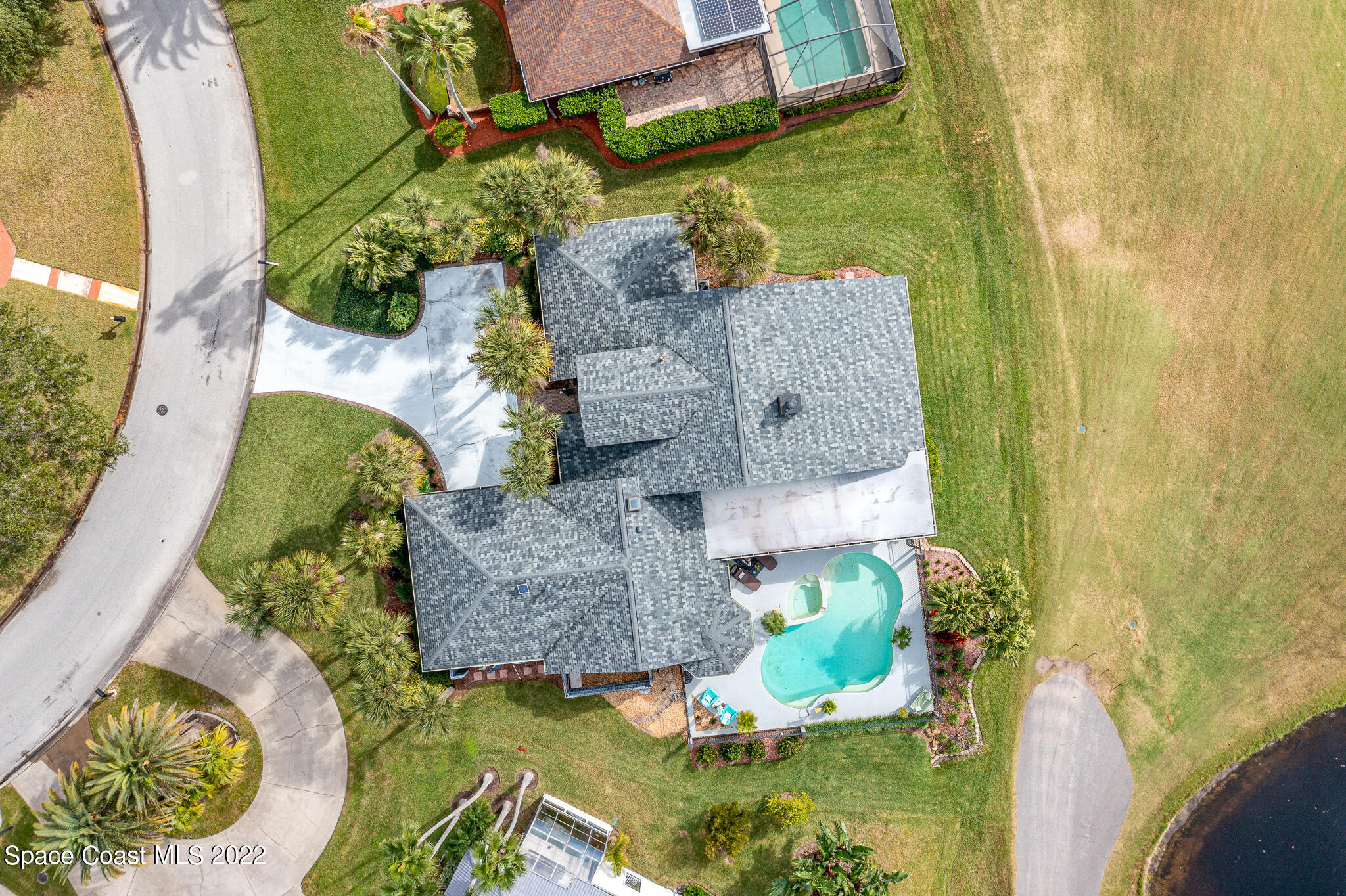 810 Kerry Downs Circle Melbourne, FL 32940 - Photo 7 of 59 an aerial view of a house with a yard swimming pool and outdoor seating