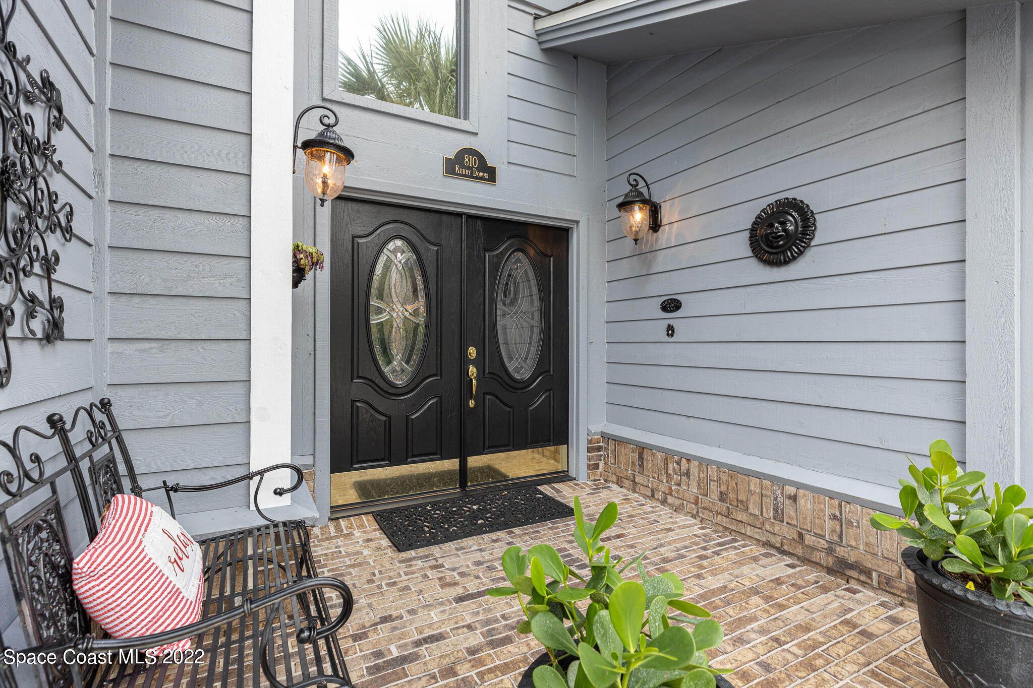 810 Kerry Downs Circle Melbourne, FL 32940 - Photo 8 of 59 a front view of a house with garden