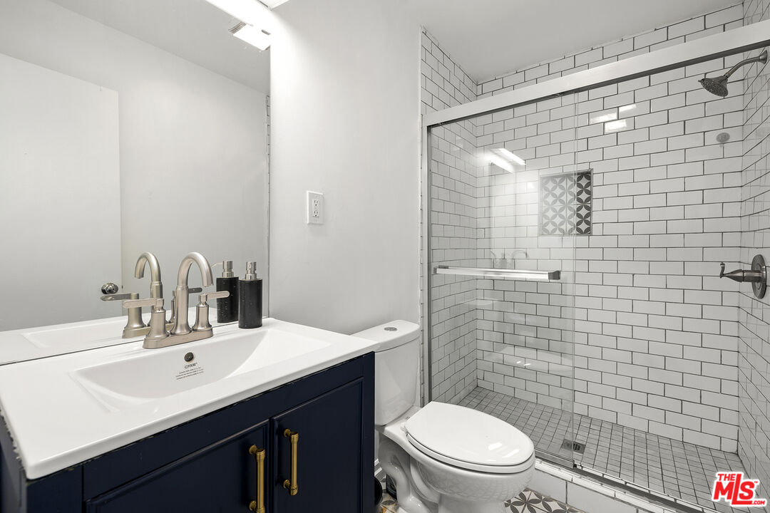 4161 Deborah Street Simi Valley, CA 93063 - Photo 12 of 14 a bathroom with a sink a toilet and shower