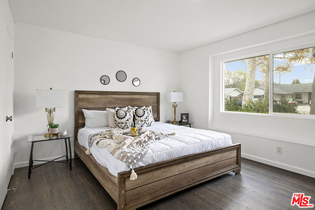 4161 Deborah Street Simi Valley, CA 93063 - Photo 9 of 14 a bedroom with a bed and a window