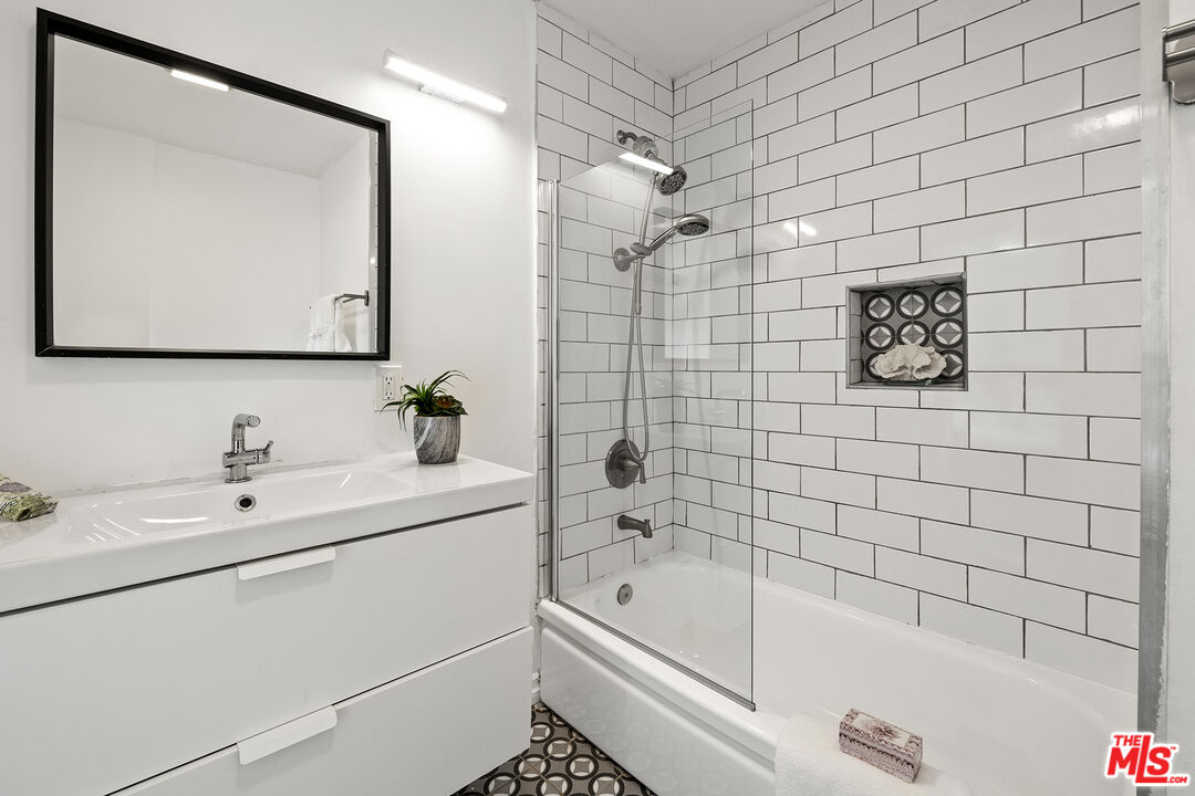 4161 Deborah Street Simi Valley, CA 93063 - Photo 10 of 14 a bathroom with a tub a sink and mirror