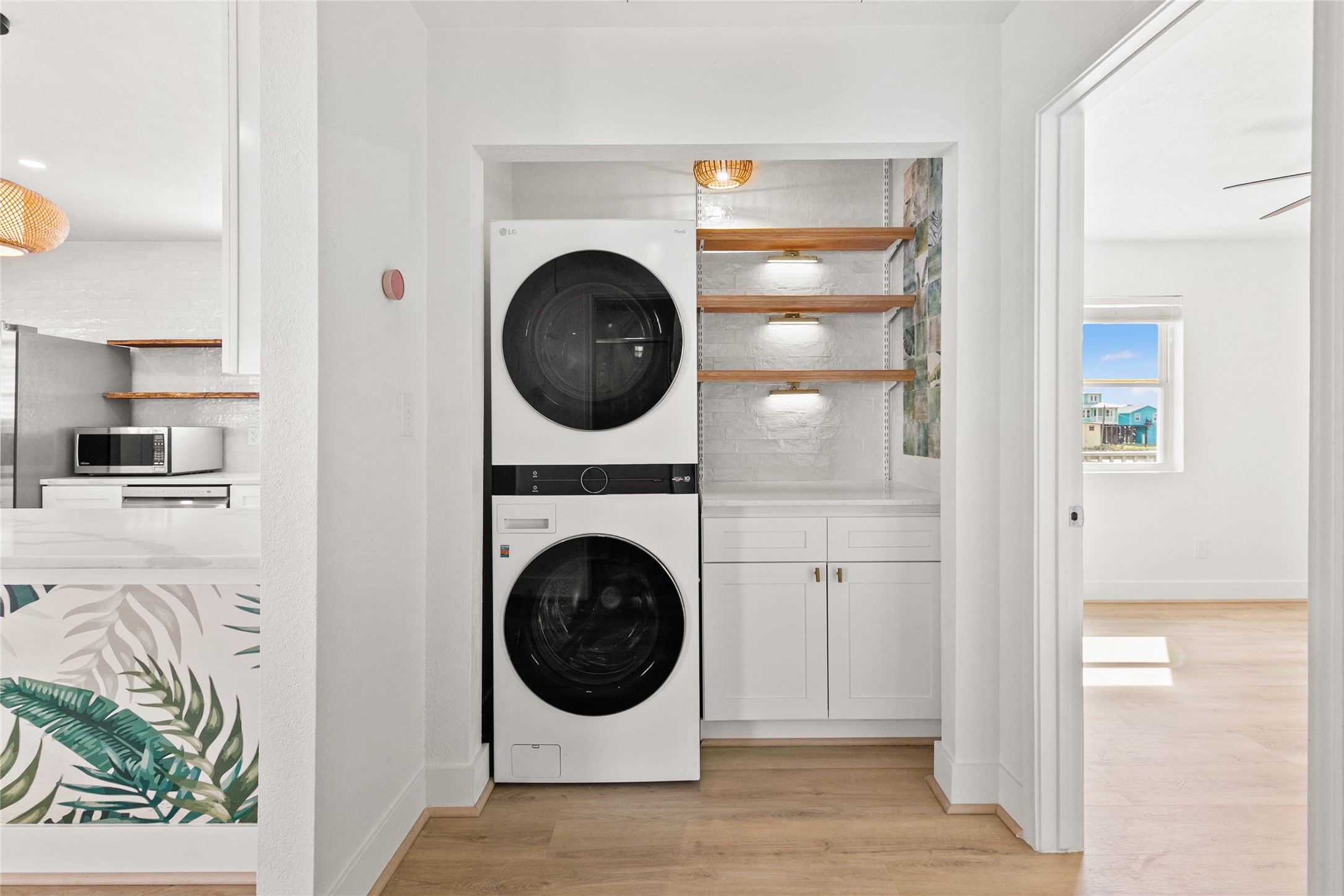 715 Caisson Street Surfside Beach, TX 77541 - Photo 18 of 35 a view of a hallway with washer and dryer