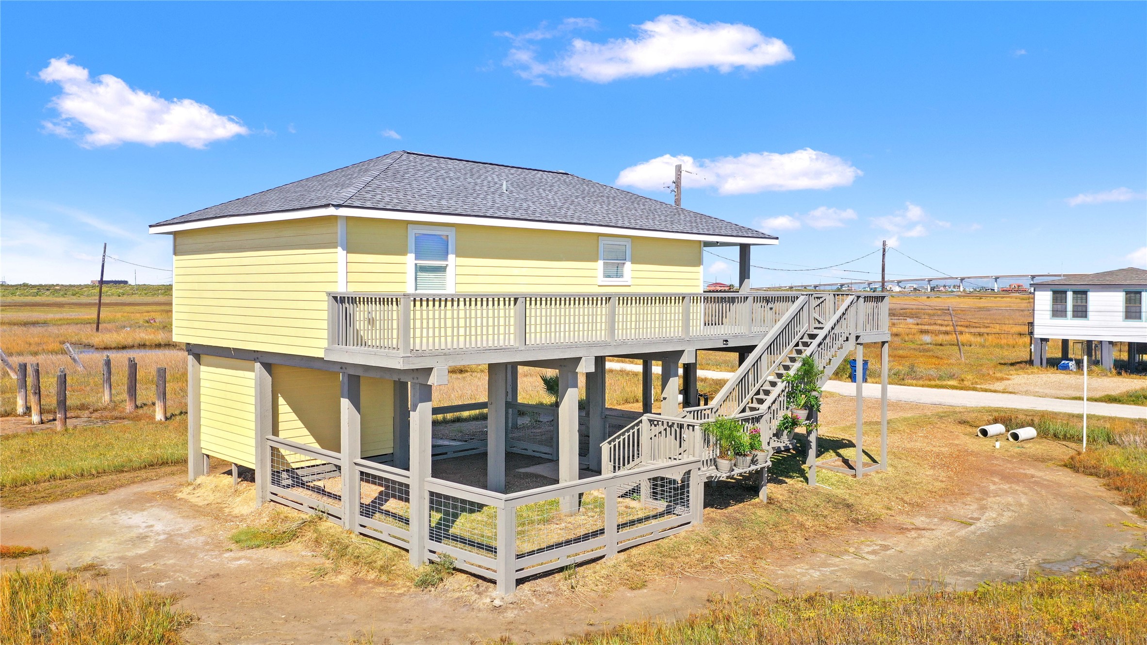 715 Caisson Street Surfside Beach, TX 77541 - Photo 28 of 35 a front view of a house with a swimming pool