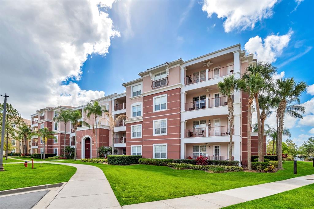 a view of a building with a yard