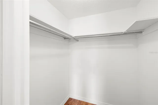 a view of a room with shelf on the wall