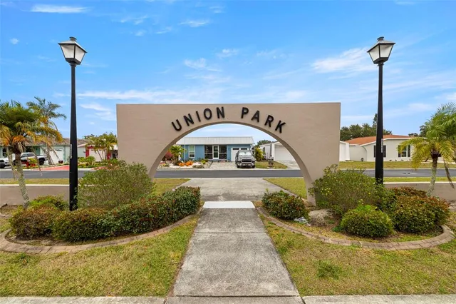 a view of swimming pool with a table and chairs