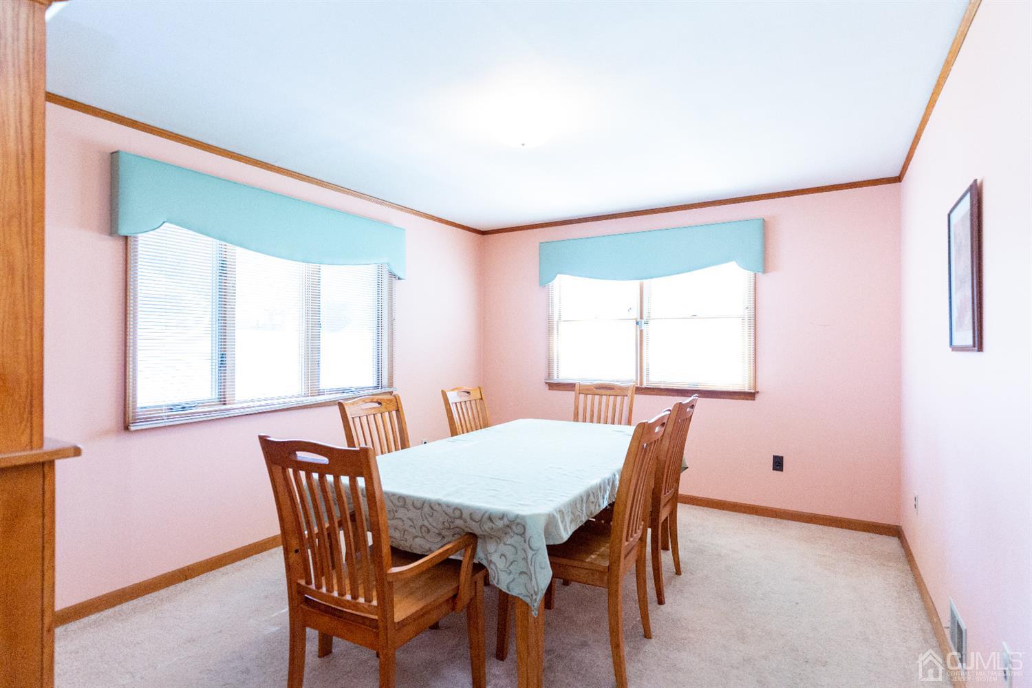 1 Crescent Road Edison, NJ 08817 - Photo 11 of 36 a view of a dining room with furniture and a window