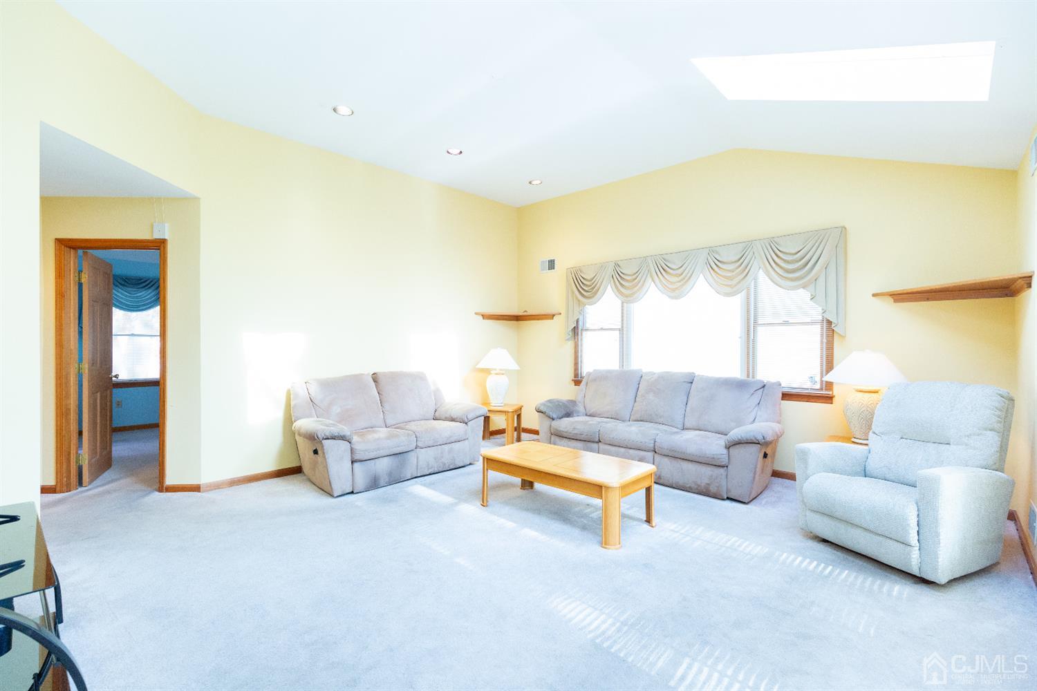 1 Crescent Road Edison, NJ 08817 - Photo 15 of 36 a living room with furniture and a large window