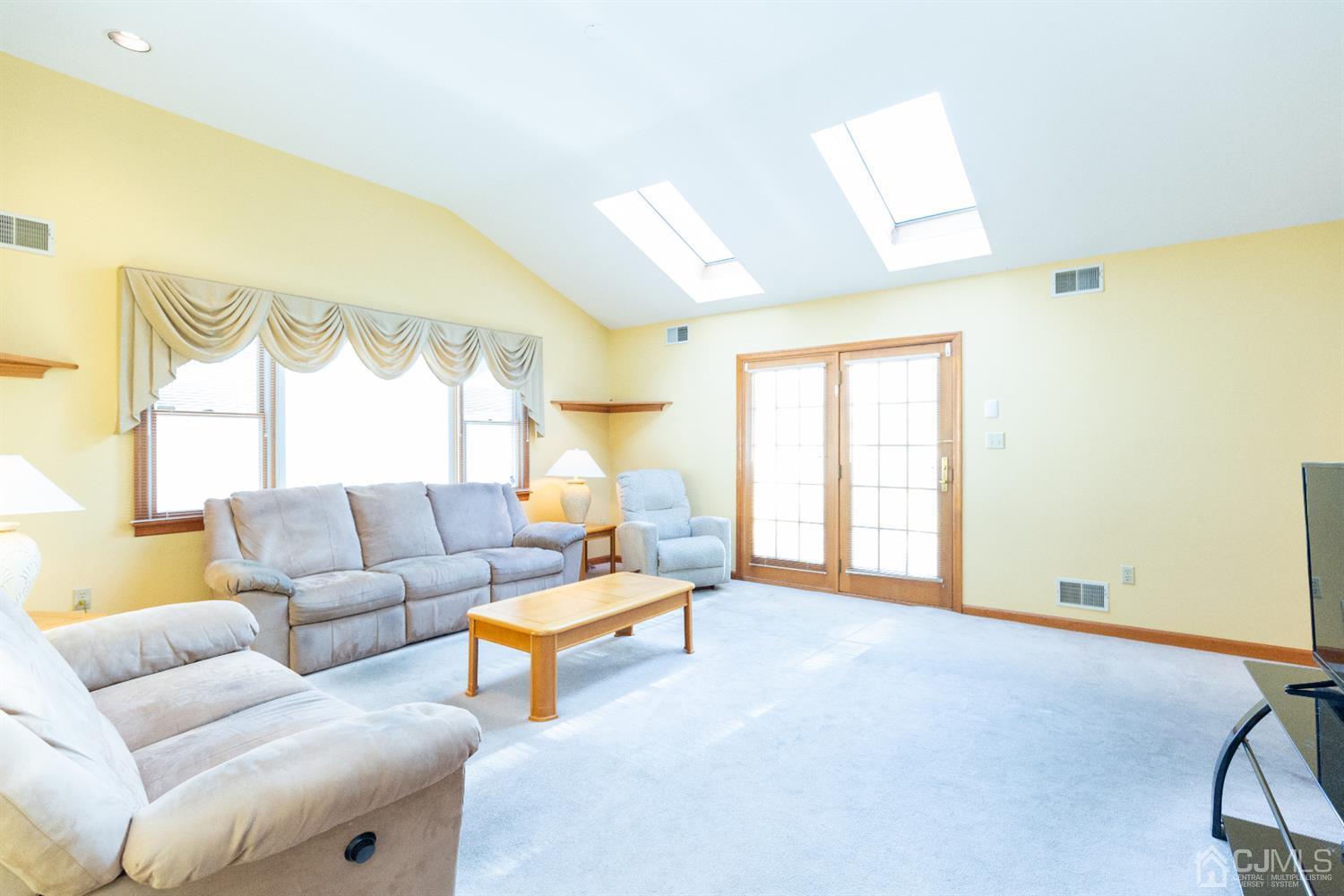1 Crescent Road Edison, NJ 08817 - Photo 16 of 36 a living room with furniture and a large window