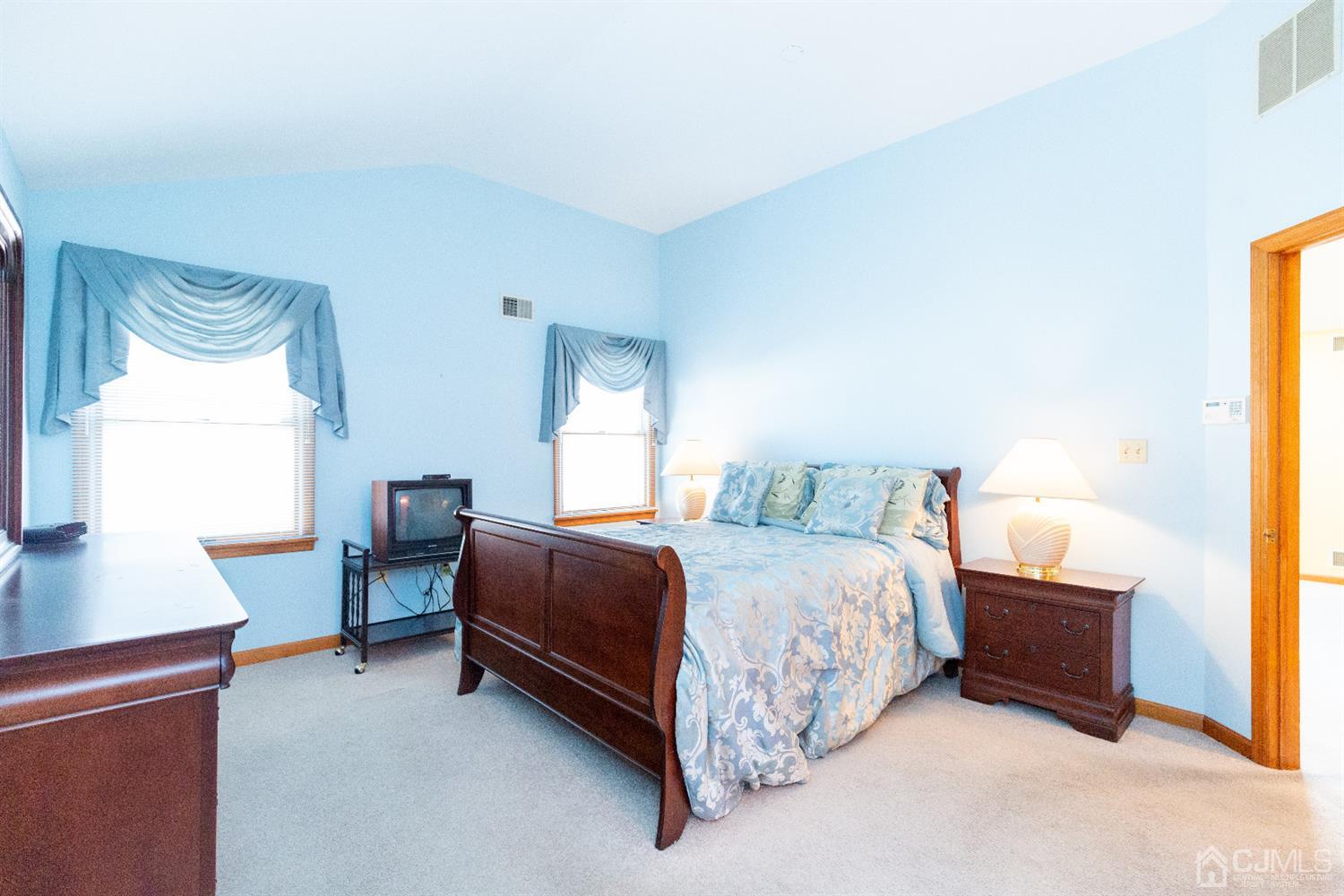 1 Crescent Road Edison, NJ 08817 - Photo 18 of 36 a bedroom with a bed chair and a window
