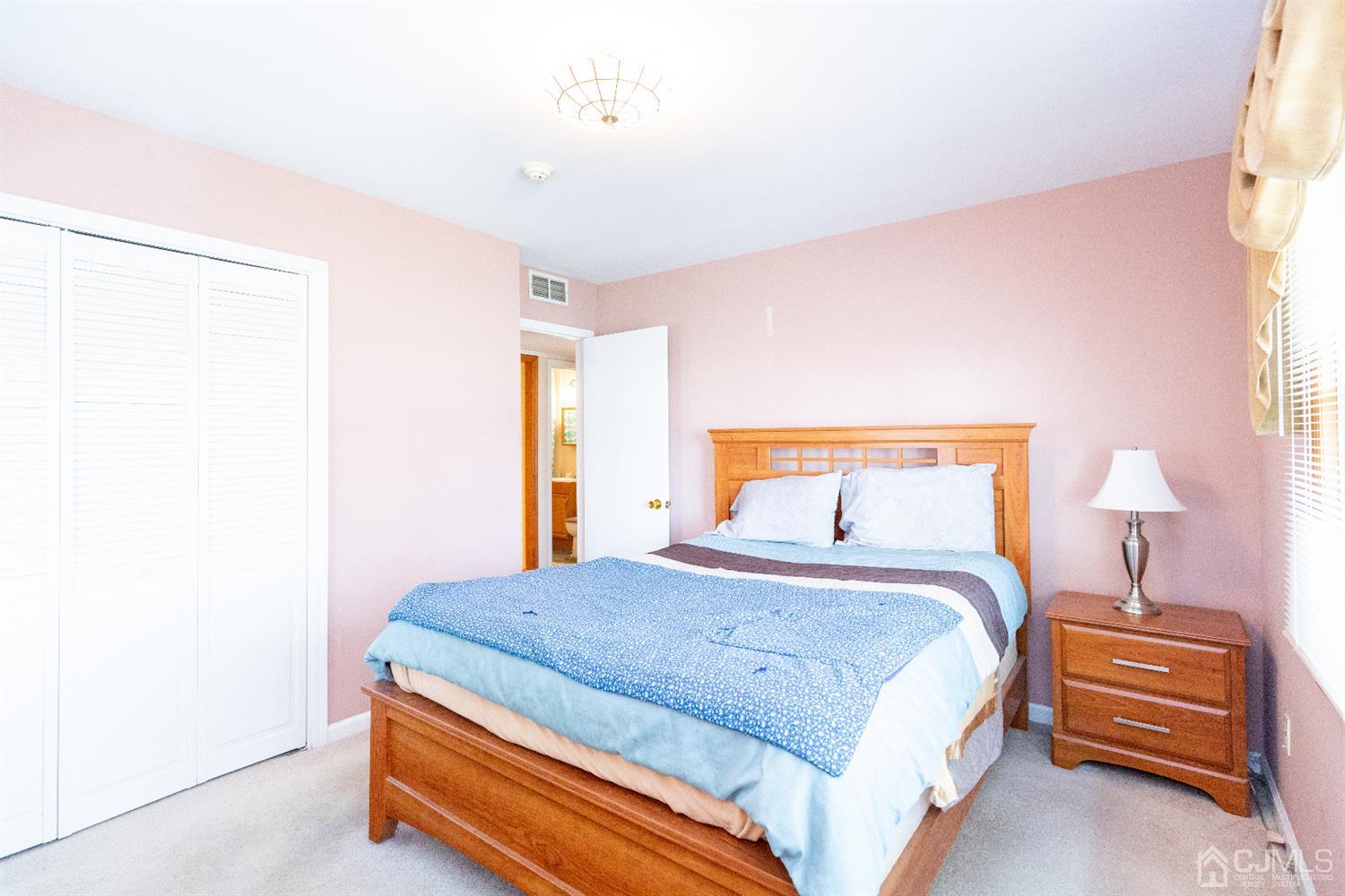 1 Crescent Road Edison, NJ 08817 - Photo 24 of 36 a bedroom with a bed and a window