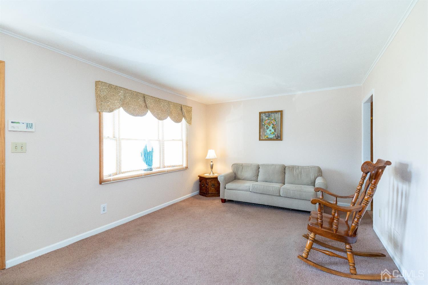 1 Crescent Road Edison, NJ 08817 - Photo 5 of 36 a living room with furniture and a window