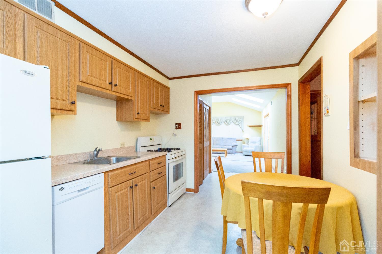 1 Crescent Road Edison, NJ 08817 - Photo 8 of 36 a kitchen with a sink a stove and cabinets