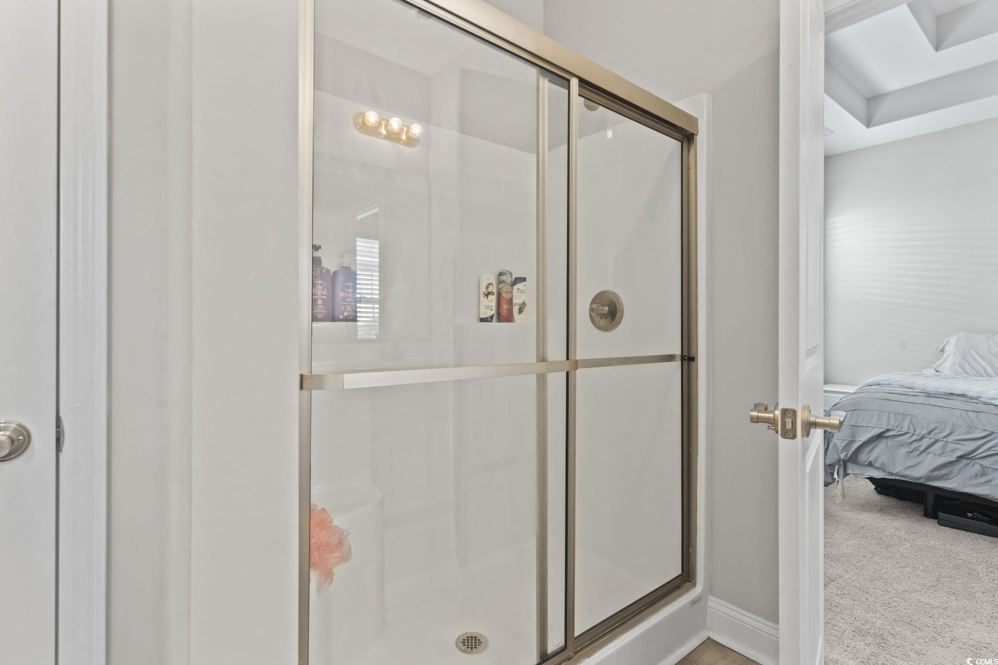 712 Hobonny Loop Longs, SC 29568 - Photo 25 of 39 Full bath featuring baseboards, ensuite bathroom, and a shower stall