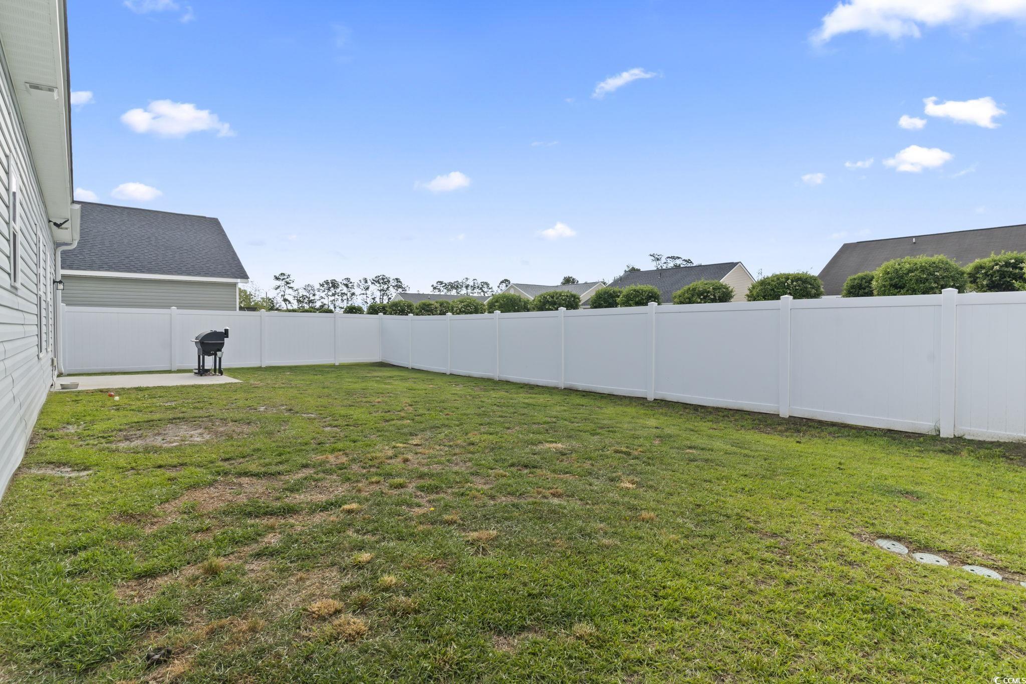 712 Hobonny Loop Longs, SC 29568 - Photo 35 of 39 View of yard with a fenced backyard