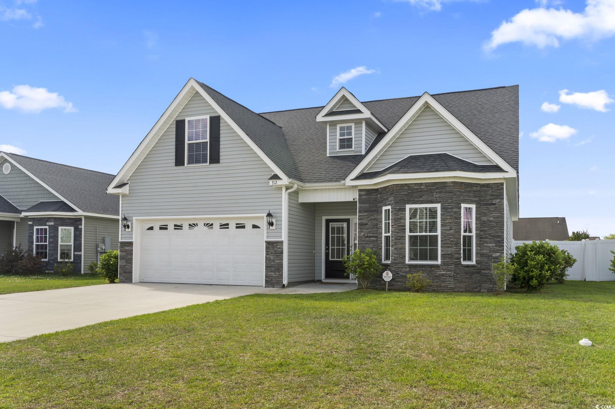712 Hobonny Loop Longs, SC 29568 - Photo 37 of 39 Craftsman inspired home with fence, a front yard, stone siding, a shingled roof, and concrete driveway