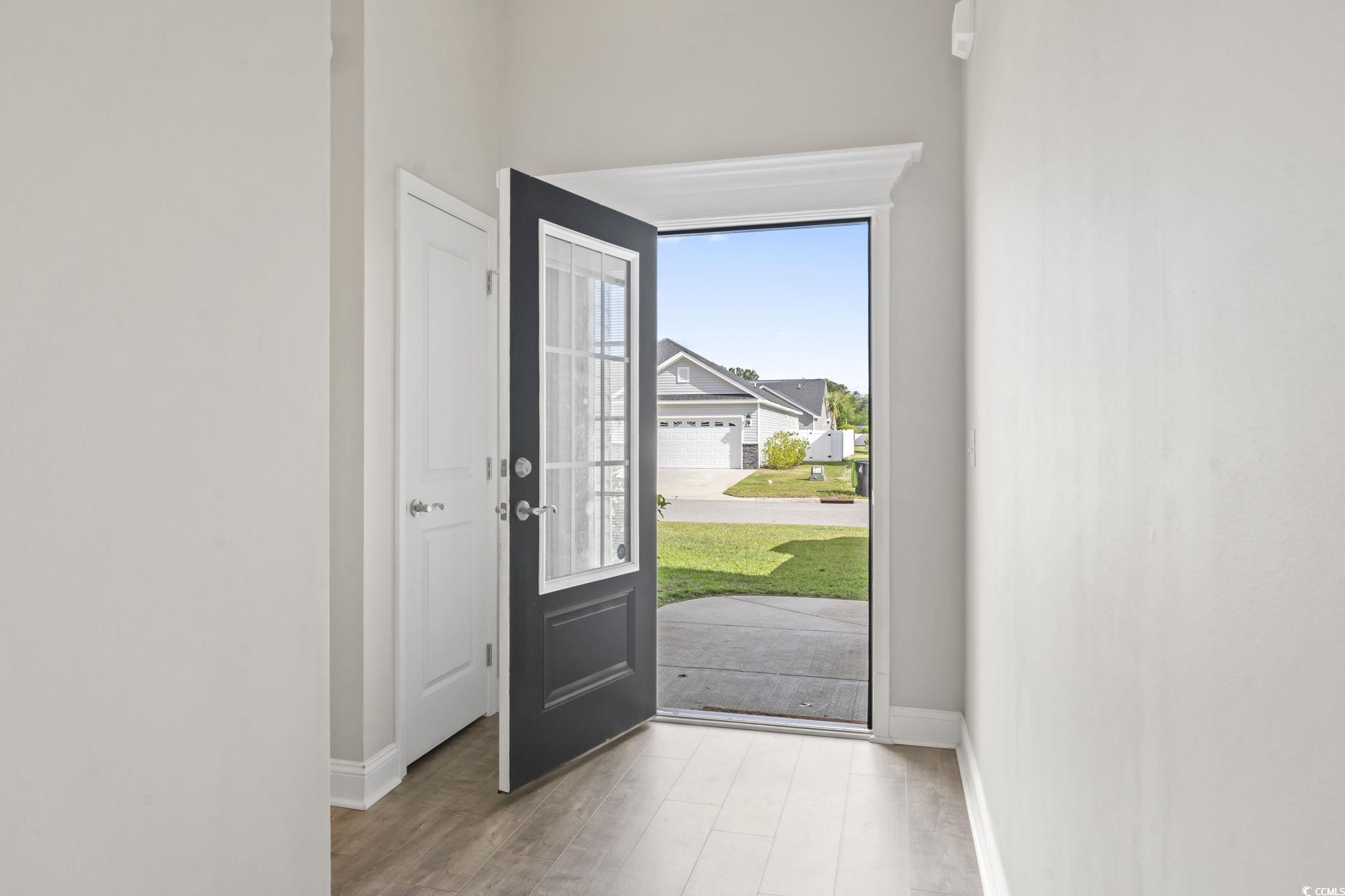 712 Hobonny Loop Longs, SC 29568 - Photo 6 of 39 Entryway with baseboards and wood finished floors
