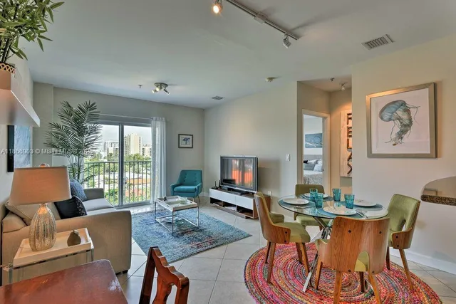 a living room with furniture and a flat screen tv