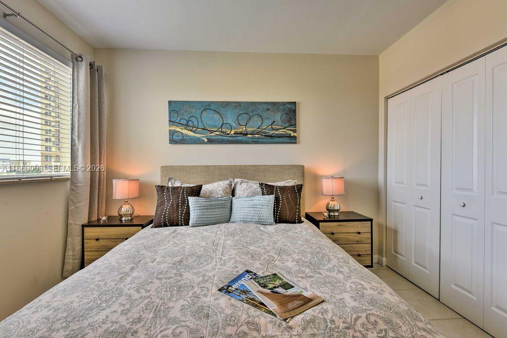 2280 Southwest 32nd Avenue, Unit 509 Miami, FL 33145 - Photo 13 of 22 a bedroom with a bed and window