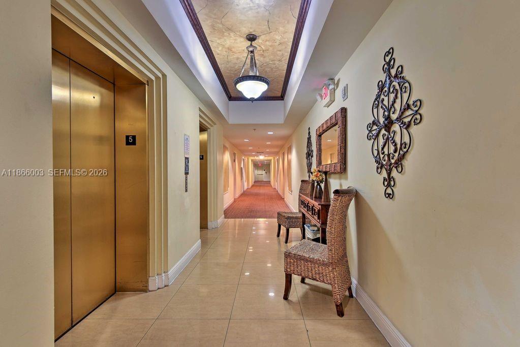 2280 Southwest 32nd Avenue, Unit 509 Miami, FL 33145 - Photo 19 of 22 a dining room with furniture and a chandelier