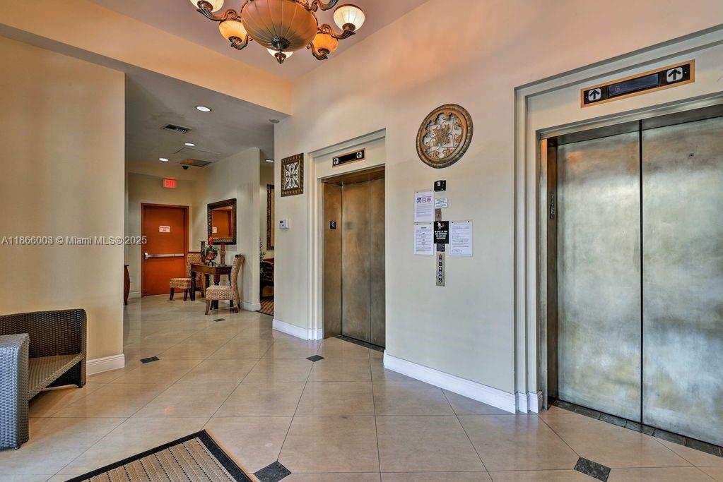 2280 Southwest 32nd Avenue, Unit 509 Miami, FL 33145 - Photo 24 of 26 a view of a hallway with workspace