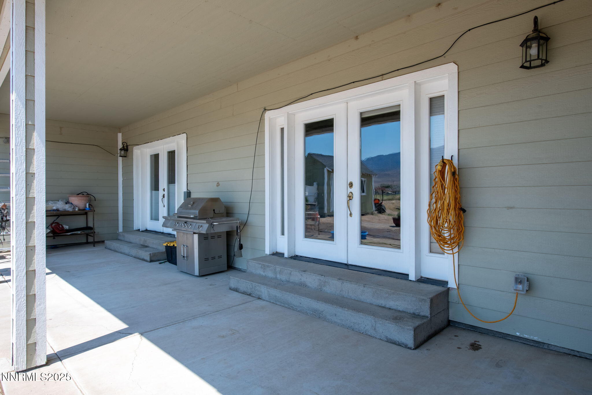 275 Imperial Road Dayton, NV 89403 - Photo 28 of 53 a living room with furniture and a chandelier