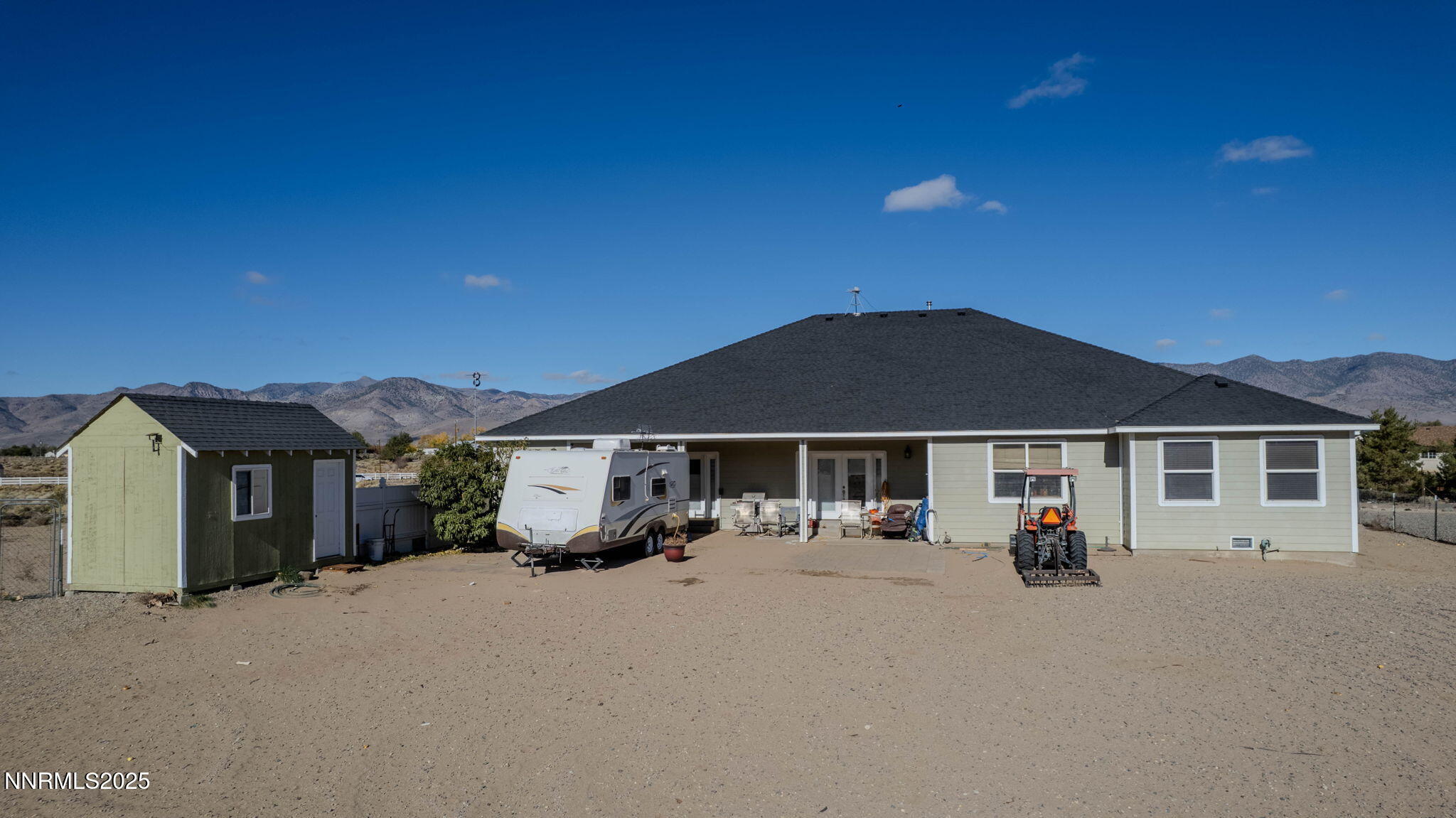 275 Imperial Road Dayton, NV 89403 - Photo 33 of 53 a view of a house with a big yard and large trees