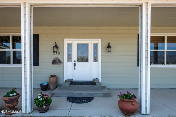 a view of a hallway with seating area