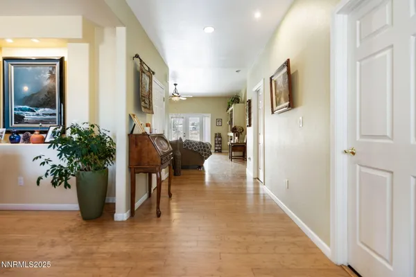 a view of entryway with wooden floor