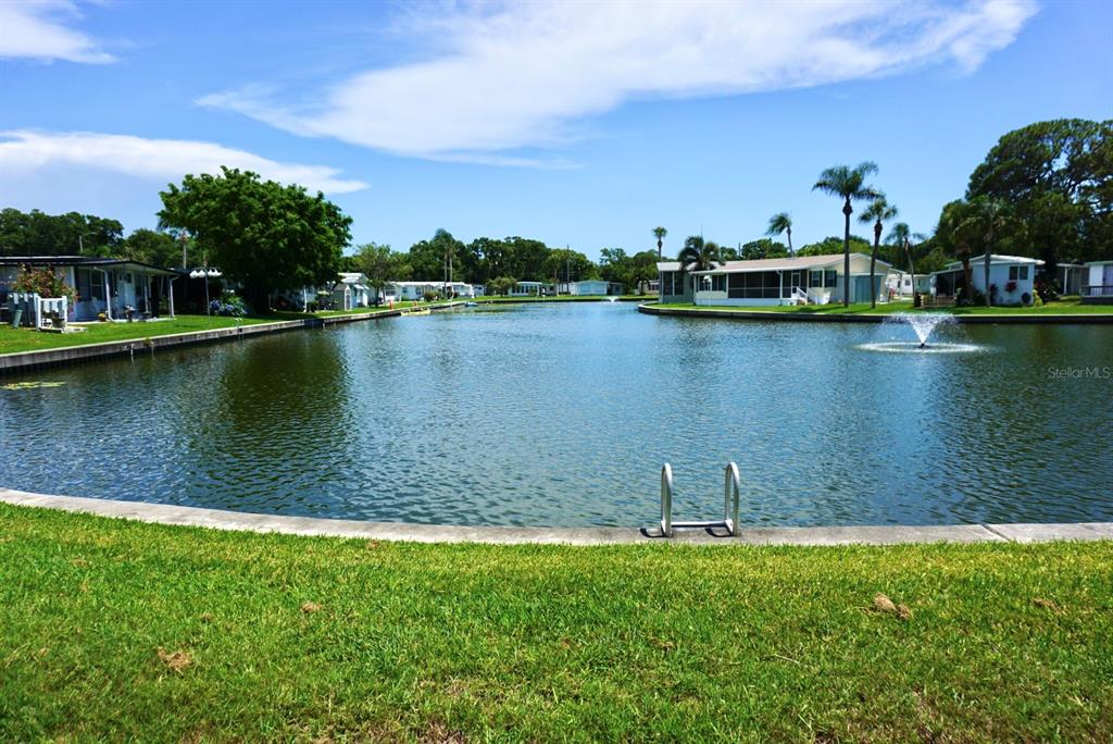 980 7th Street Northwest, Unit 71 Largo, FL 33770 - Photo 23 of 23 a view of a lake with houses in the back