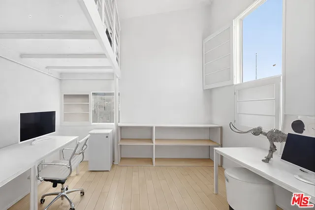 a view of a patio with couches and a large tree