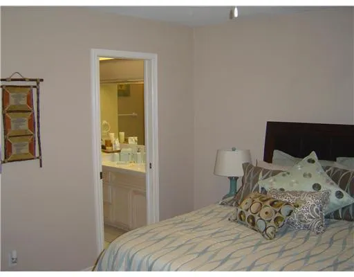 a bedroom with a bed and a cabinets