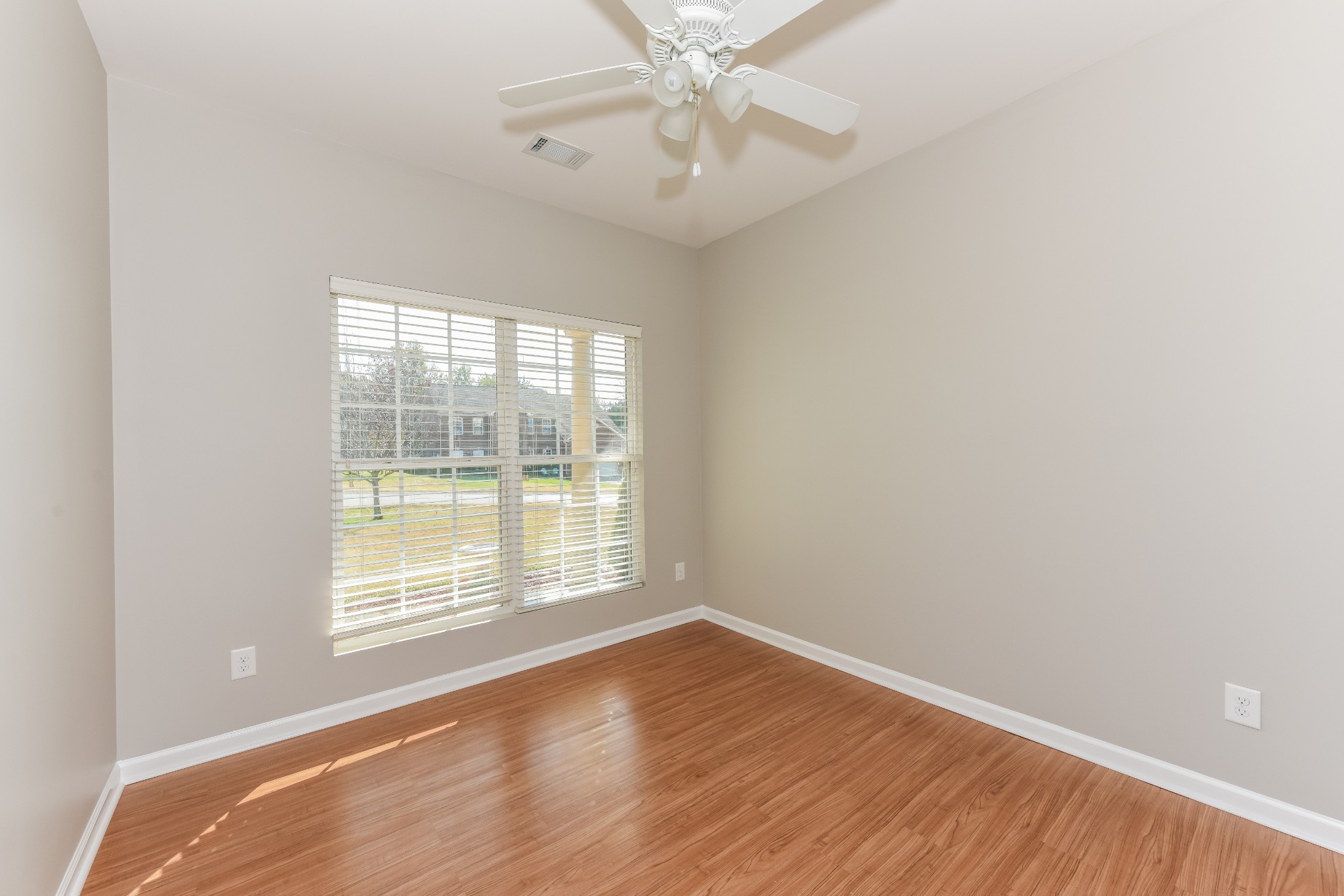 2015 Lincoln Road Spring Hill, TN 37174 - Photo 11 of 17 an empty room with wooden floor and windows