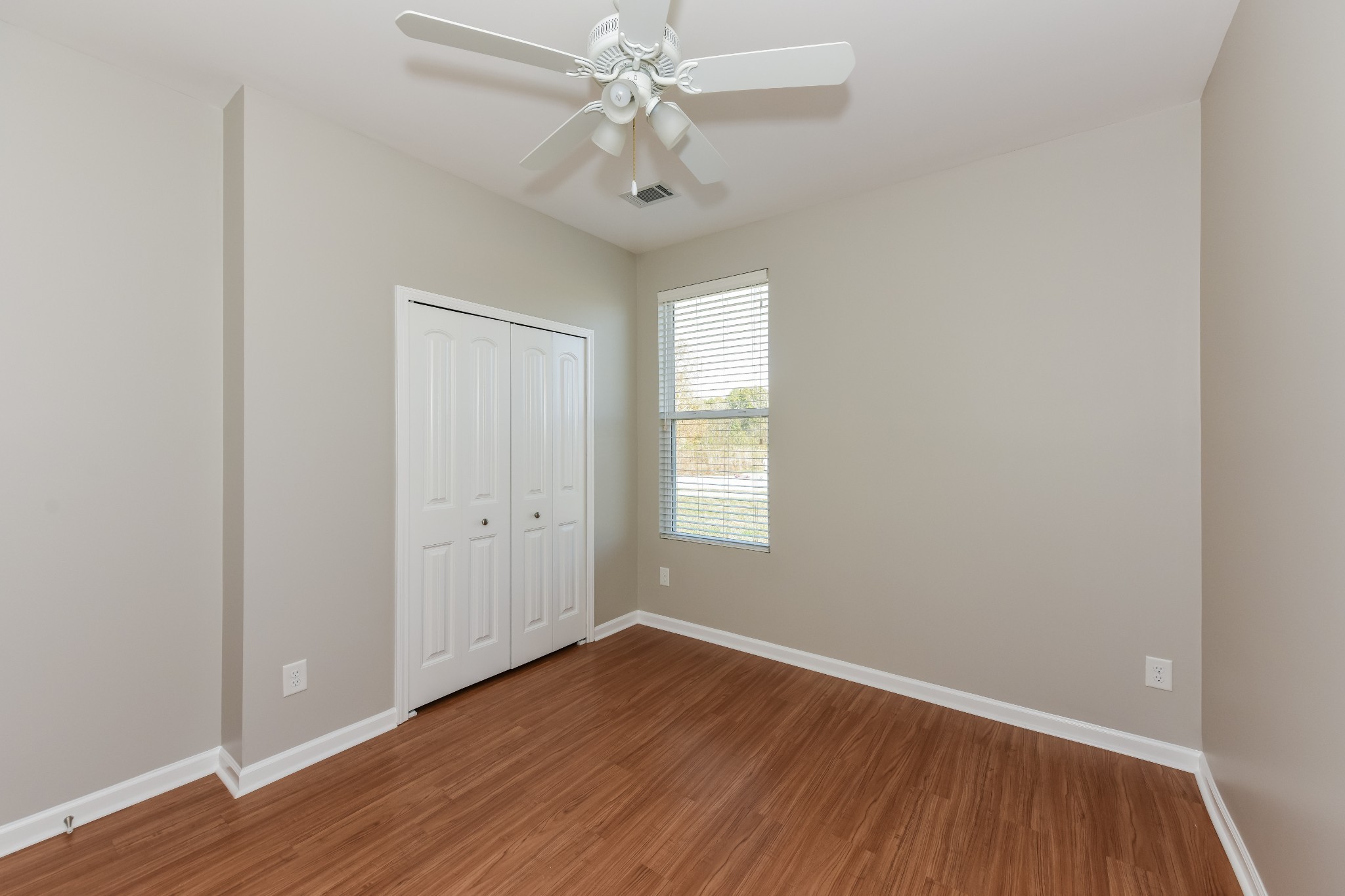 2015 Lincoln Road Spring Hill, TN 37174 - Photo 12 of 17 an empty room with wooden floor and windows