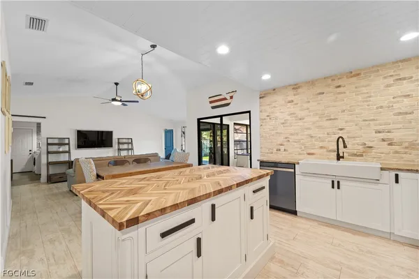 a kitchen with a stove and a sink