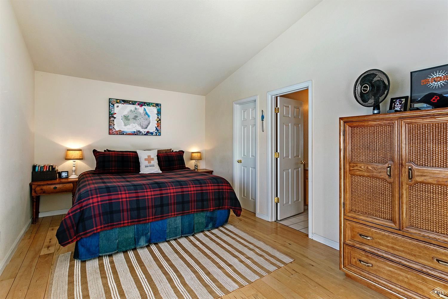 13 Eagle Drive, Unit B Avon, CO 81620 - Photo 11 of 25 a bedroom with a bed and dresser