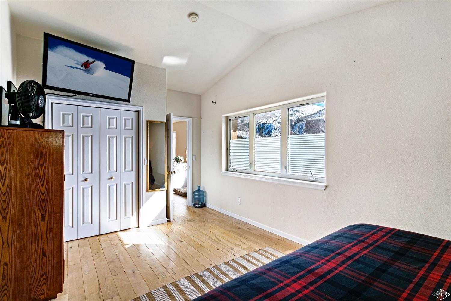 13 Eagle Drive, Unit B Avon, CO 81620 - Photo 13 of 25 a bedroom with furniture and window