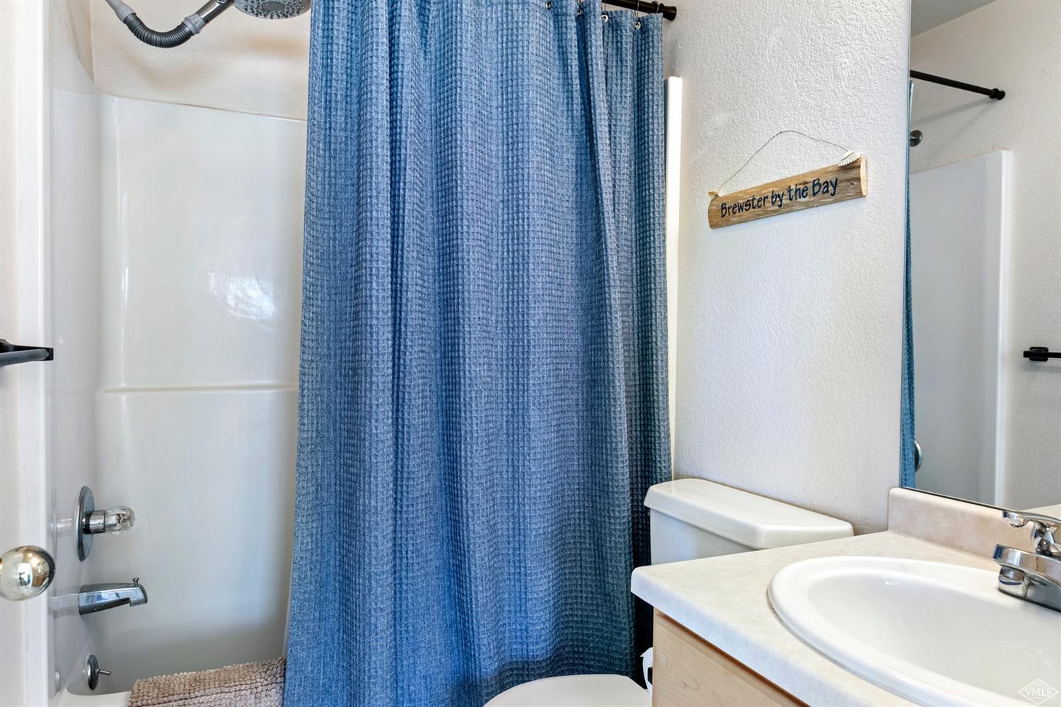 13 Eagle Drive, Unit B Avon, CO 81620 - Photo 14 of 25 a bathroom with a sink a toilet and shower