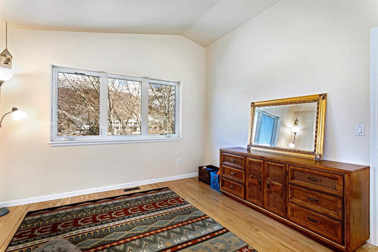13 Eagle Drive, Unit B Avon, CO 81620 - Photo 15 of 25 a bedroom with furniture and window