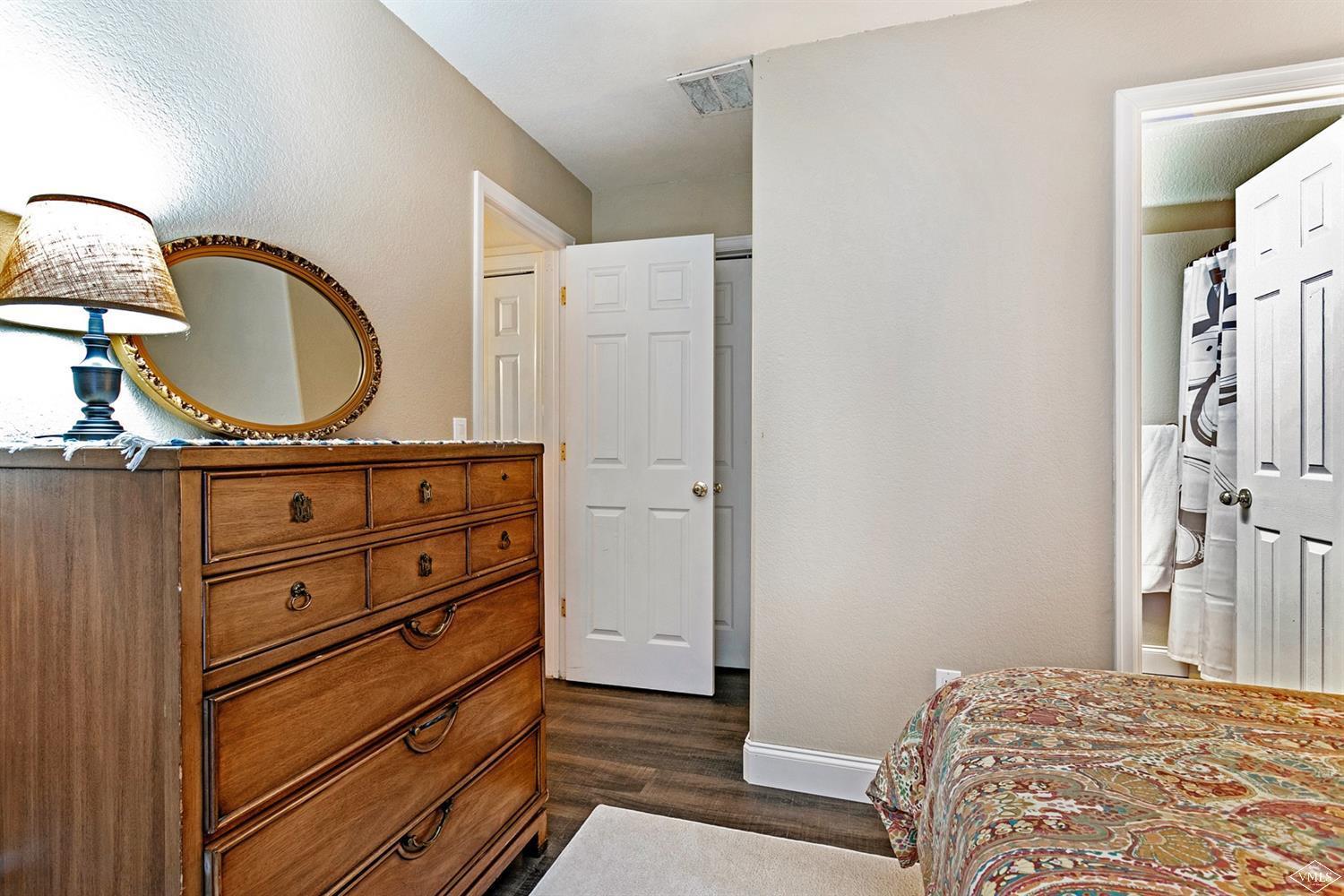 13 Eagle Drive, Unit B Avon, CO 81620 - Photo 18 of 25 a bedroom with a bed and a dresser