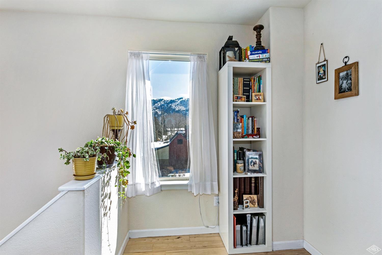 13 Eagle Drive, Unit B Avon, CO 81620 - Photo 10 of 25 a shelf with books and knick knacks on it