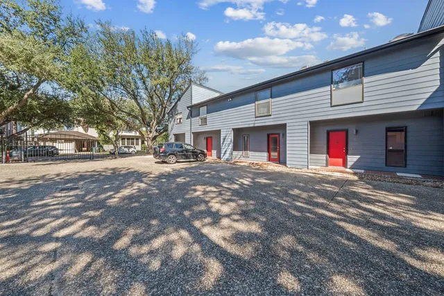 a view of street with large trees