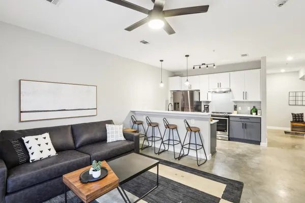 a kitchen with a sink and chandelier