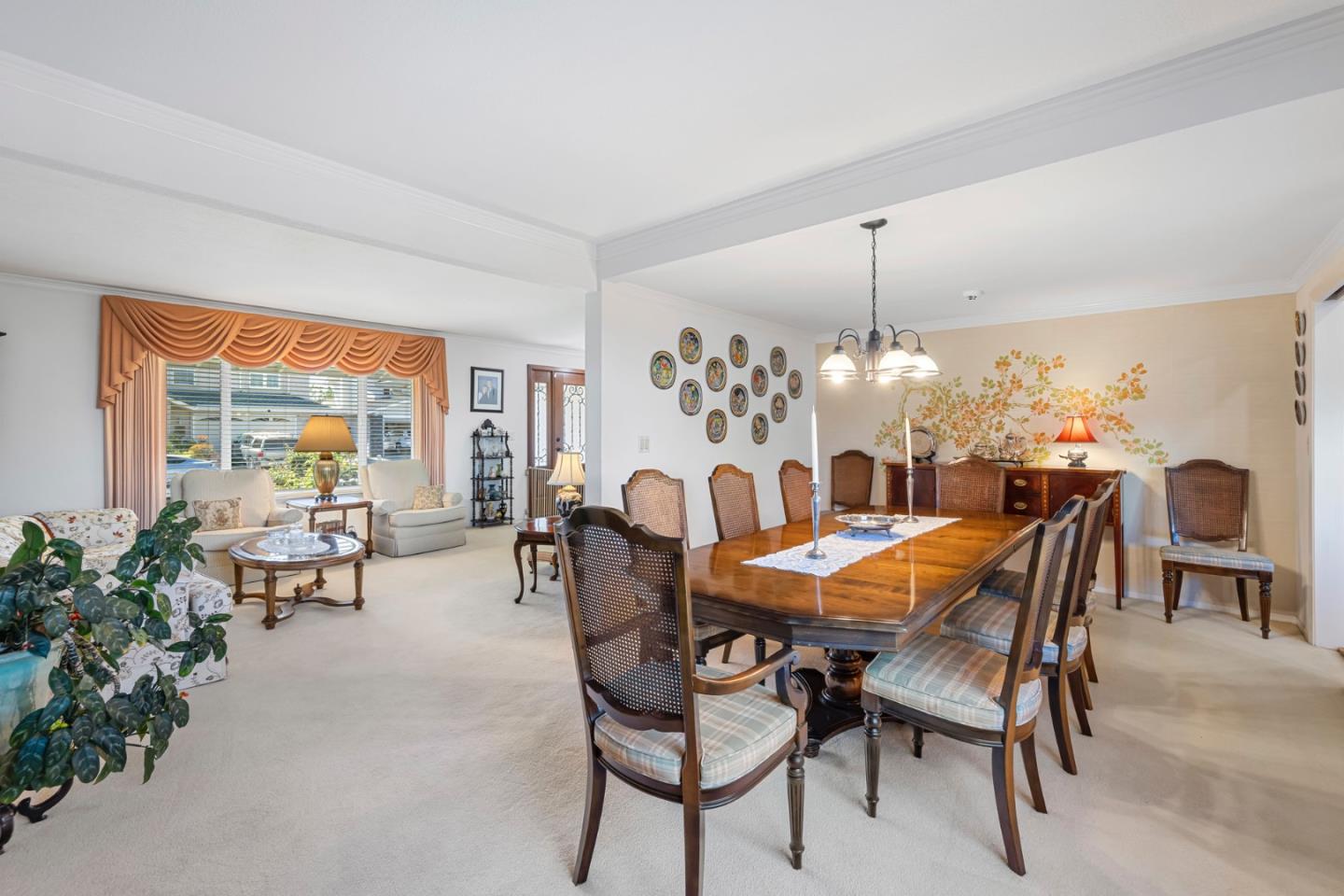 1272 Stardust Way Milpitas, CA 95035 - Photo 14 of 61 a dining room with furniture a large window and a chandelier