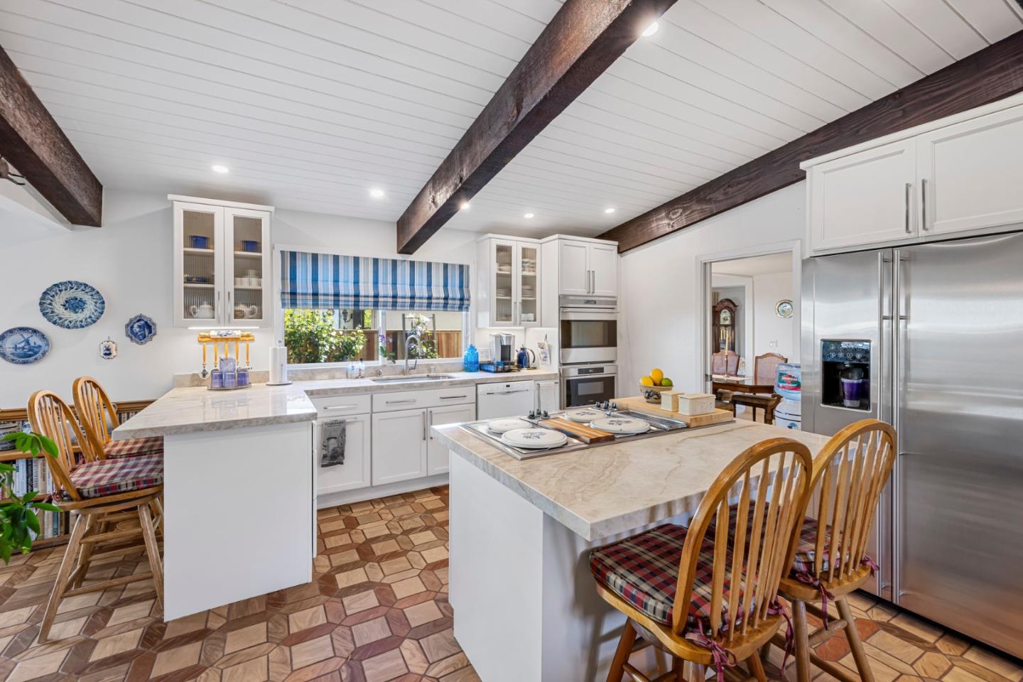 1272 Stardust Way Milpitas, CA 95035 - Photo 17 of 61 a kitchen with a table chairs stove and refrigerator